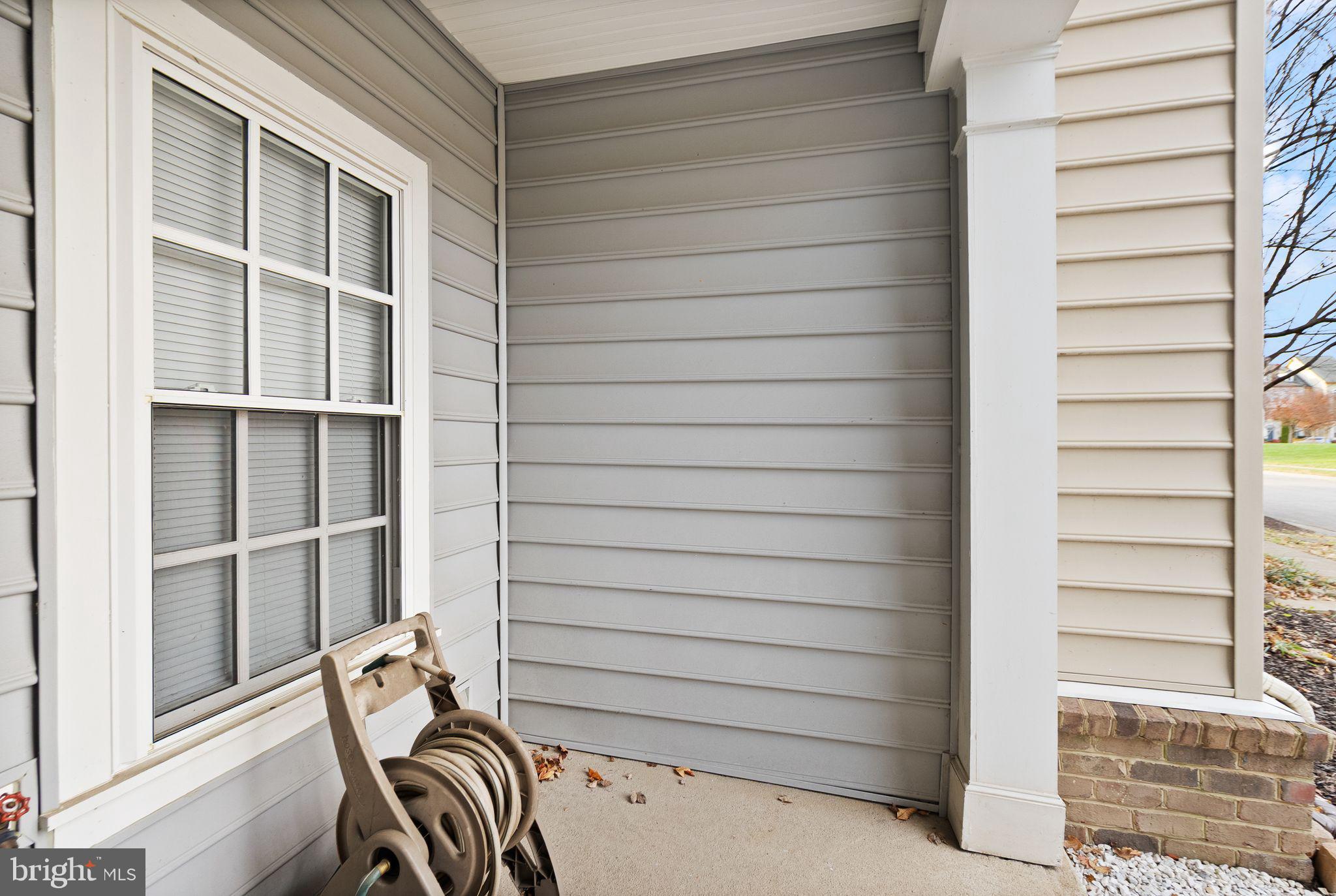 11821 Whitworth Cannon Lane Bristow, VA 20136 - Photo 8 of 70 a view of a room with a door and a window
