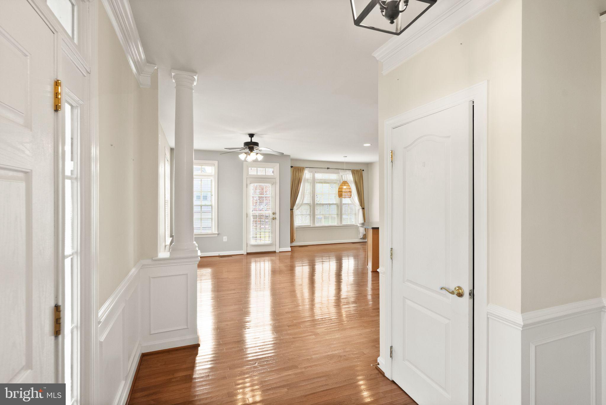 11821 Whitworth Cannon Lane Bristow, VA 20136 - Photo 10 of 70 a view of empty room with wooden floor and fan