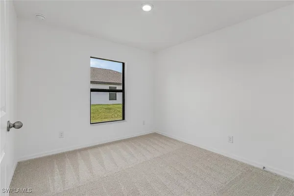 a view of an empty room and window
