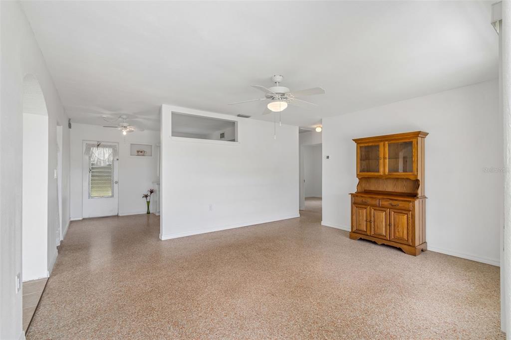 6634 Manor Beach Road New Port Richey, FL 34652 - Photo 7 of 64 a view of an empty room with a kitchen