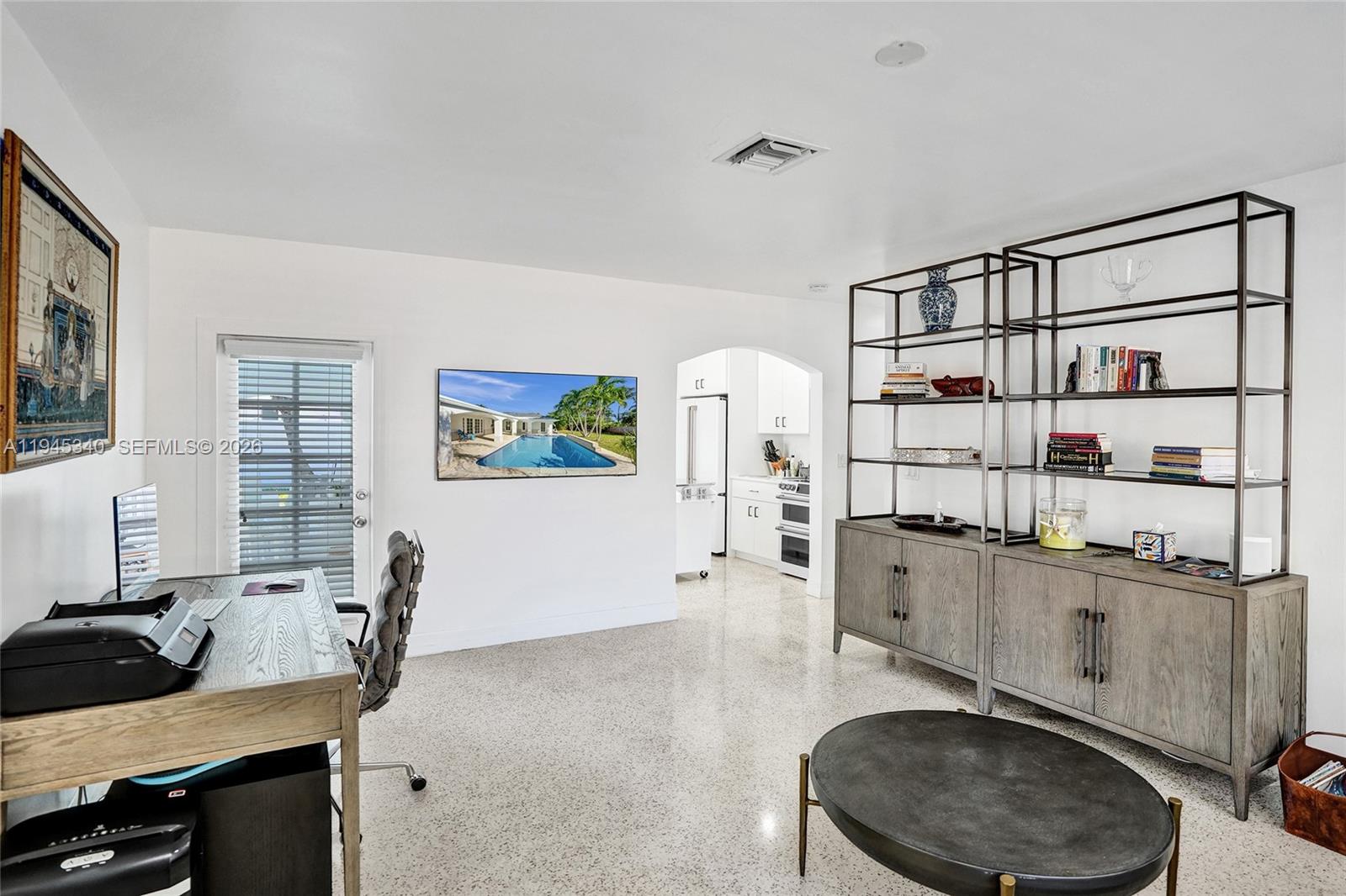 280 Northeast Spanish Court, Unit 280 Boca Raton, FL 33432 - Photo 24 of 41 a room with furniture and a flat screen tv