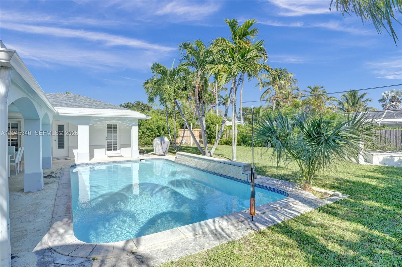 280 Northeast Spanish Court, Unit 280 Boca Raton, FL 33432 - Photo 34 of 41 a view of a house with a yard