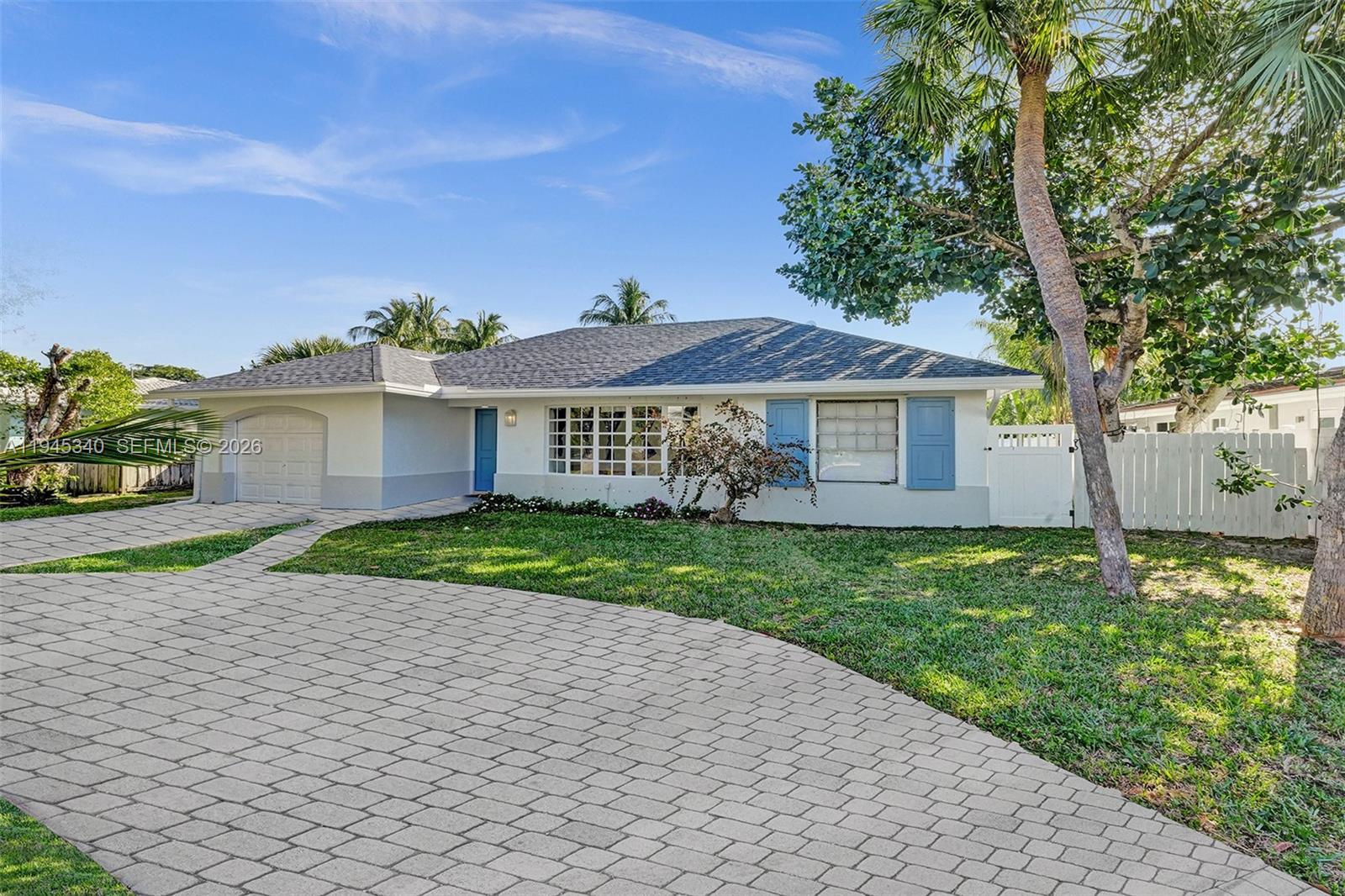 280 Northeast Spanish Court, Unit 280 Boca Raton, FL 33432 - Photo 39 of 41 a view of a house with a yard