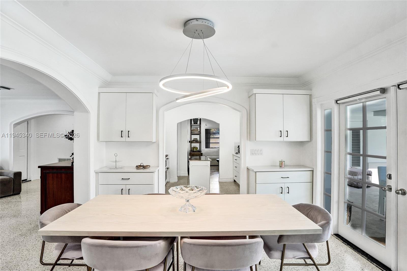 280 Northeast Spanish Court, Unit 280 Boca Raton, FL 33432 - Photo 9 of 41 a view of a dining room with furniture