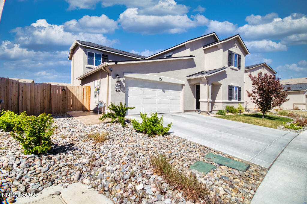 8957 Buffalo Grove Drive Reno, NV 89506 - Photo 5 of 59 a front view of house with yard