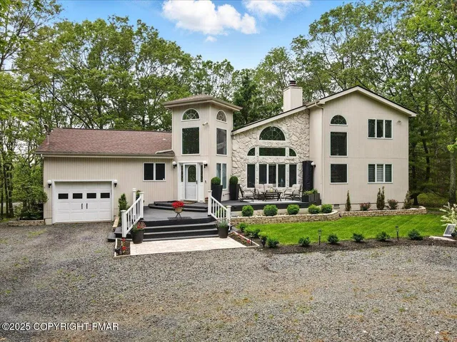a large kitchen with stainless steel appliances granite countertop a stove refrigerator sink and cabinets