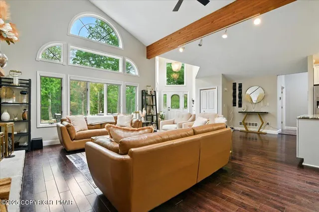 a view of a dining area with furniture and wooden floor