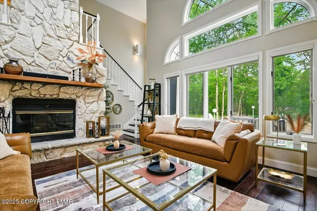 a kitchen with stainless steel appliances kitchen island granite countertop a refrigerator and a stove