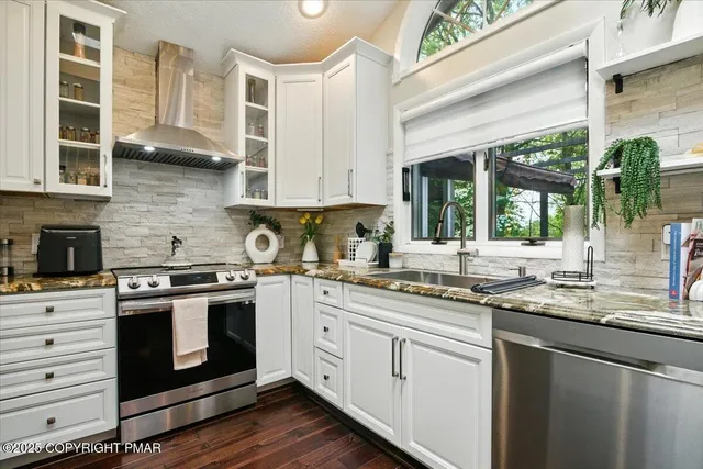 a bathroom with a sink toilet and mirror