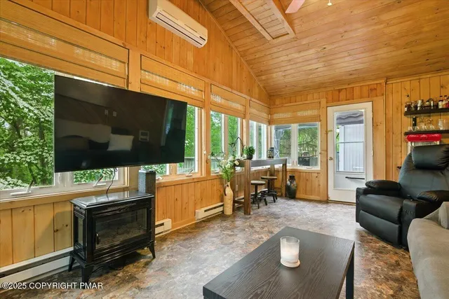 a view of a livingroom with furniture and a flat screen tv