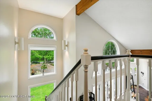 a building outdoor space with patio furniture and potted plants