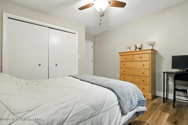 a building outdoor space with patio furniture and potted plants