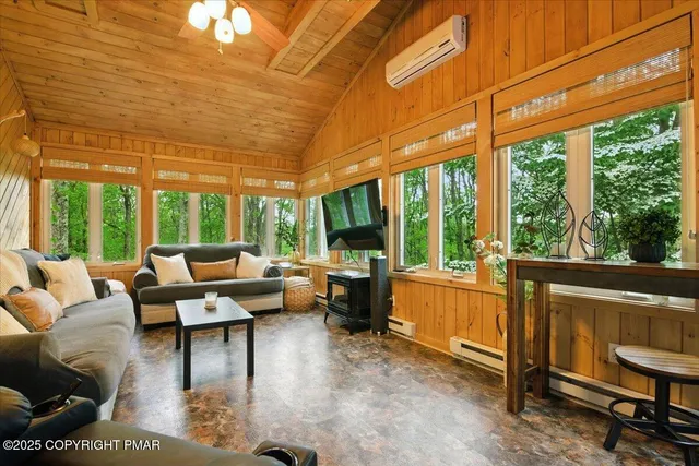 a bathroom with a sink a bathtub and next to a window