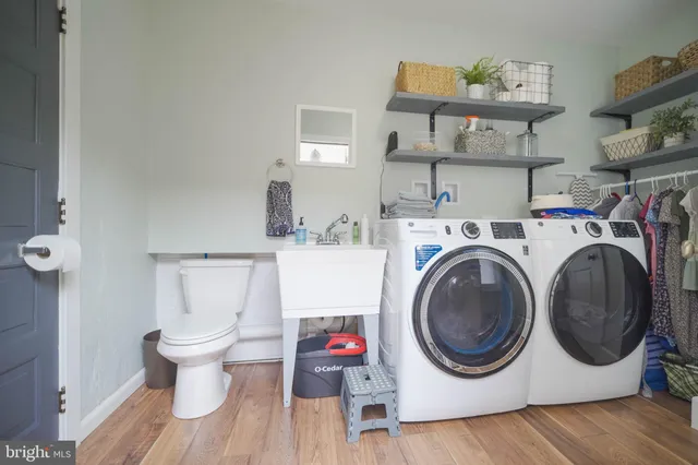 a bathroom with a toilet and shower curtain