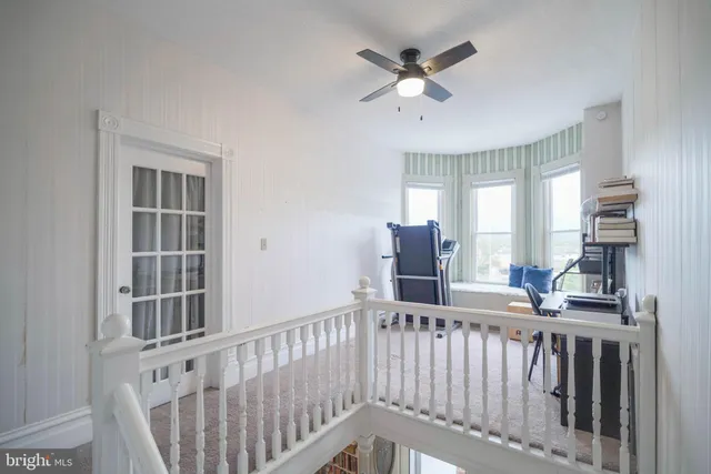 a bedroom with a bed lamp and window