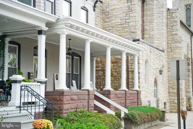 front view of a building with a garden