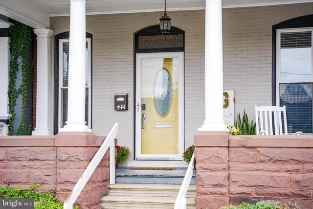 a front view of a house with a porch