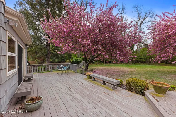 a view of a backyard with sitting area furniture and garden