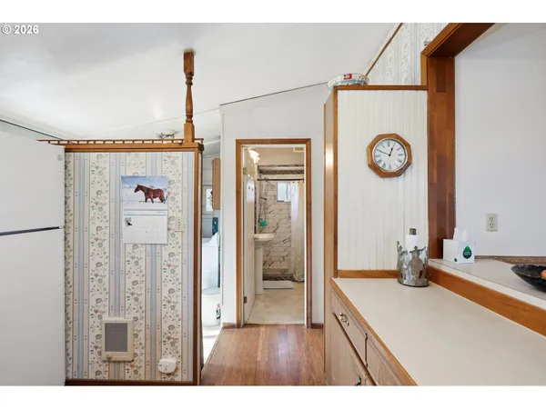 a kitchen with a refrigerator and a stove