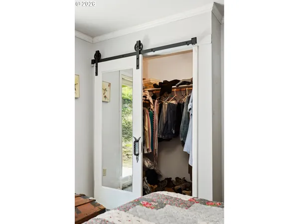 a view of a bedroom from a hallway