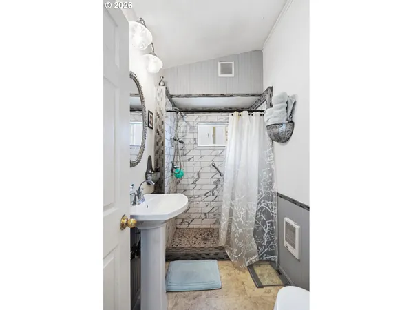 a bathroom with a sink and mirror