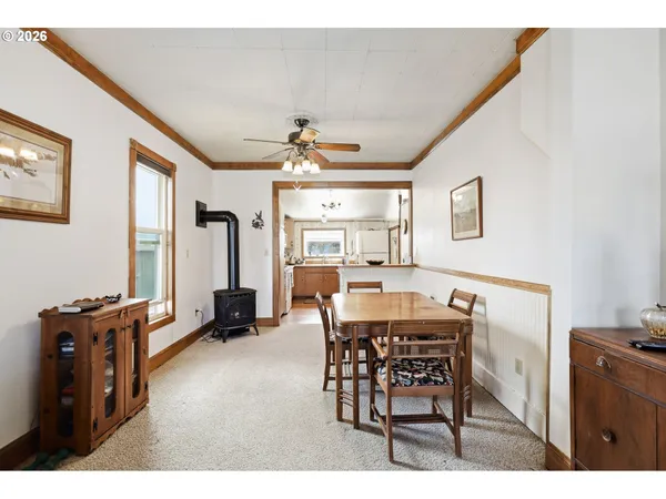 a dining room with furniture and window
