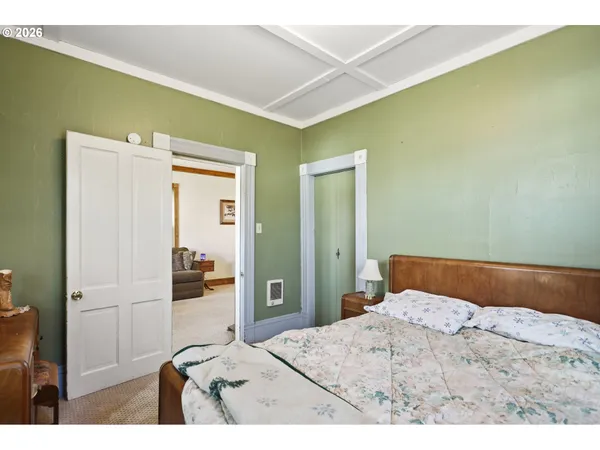 a bedroom with a bed and a cabinets