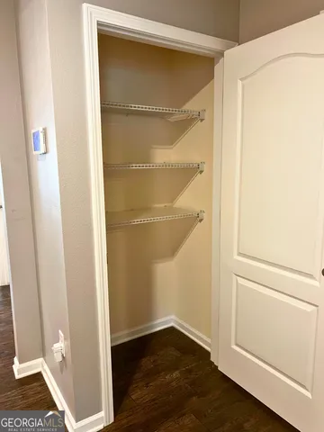 a kitchen with a stove a sink and a microwave