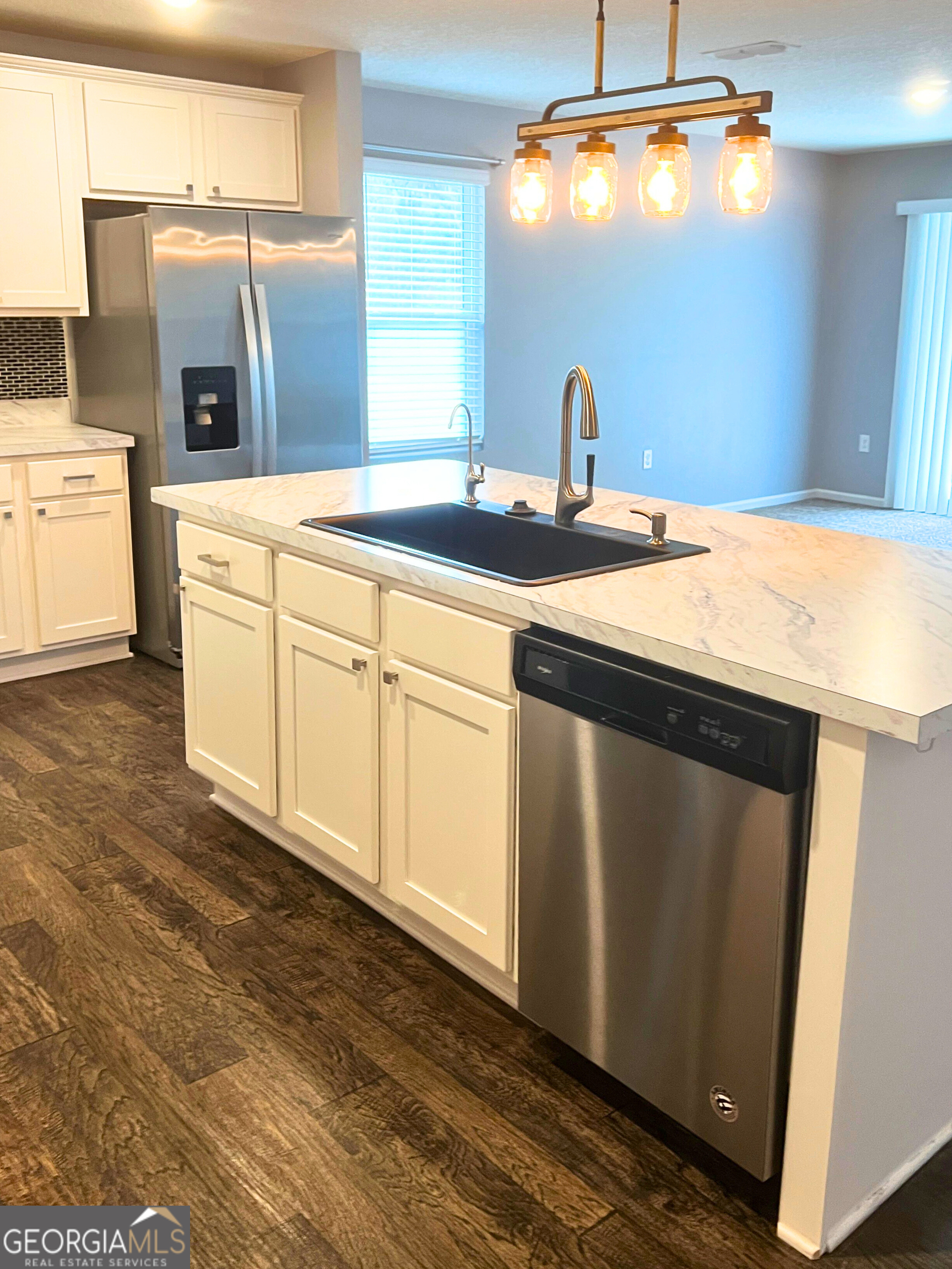 129 Holston Circle Kingsland, GA 31548 - Photo 15 of 25 a kitchen with stainless steel appliances granite countertop a sink and a stove