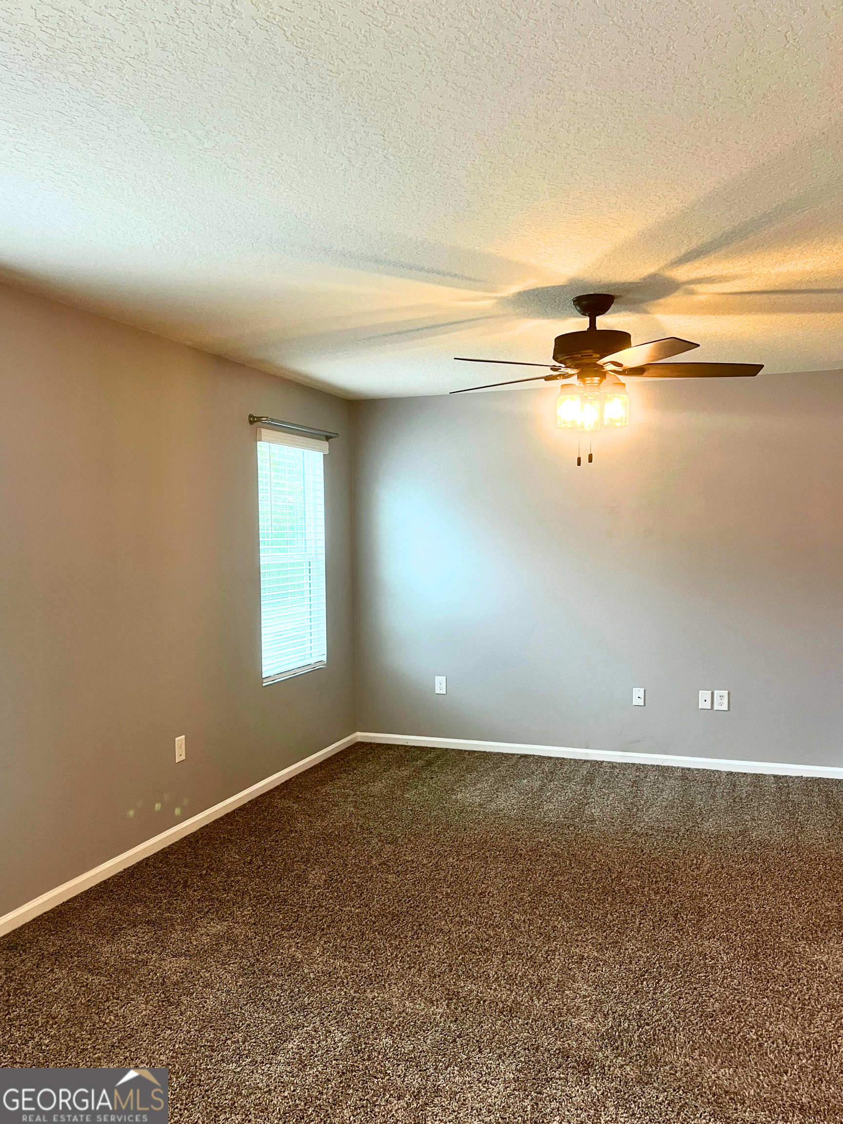 129 Holston Circle Kingsland, GA 31548 - Photo 19 of 25 an empty room with a wooden floor and a window