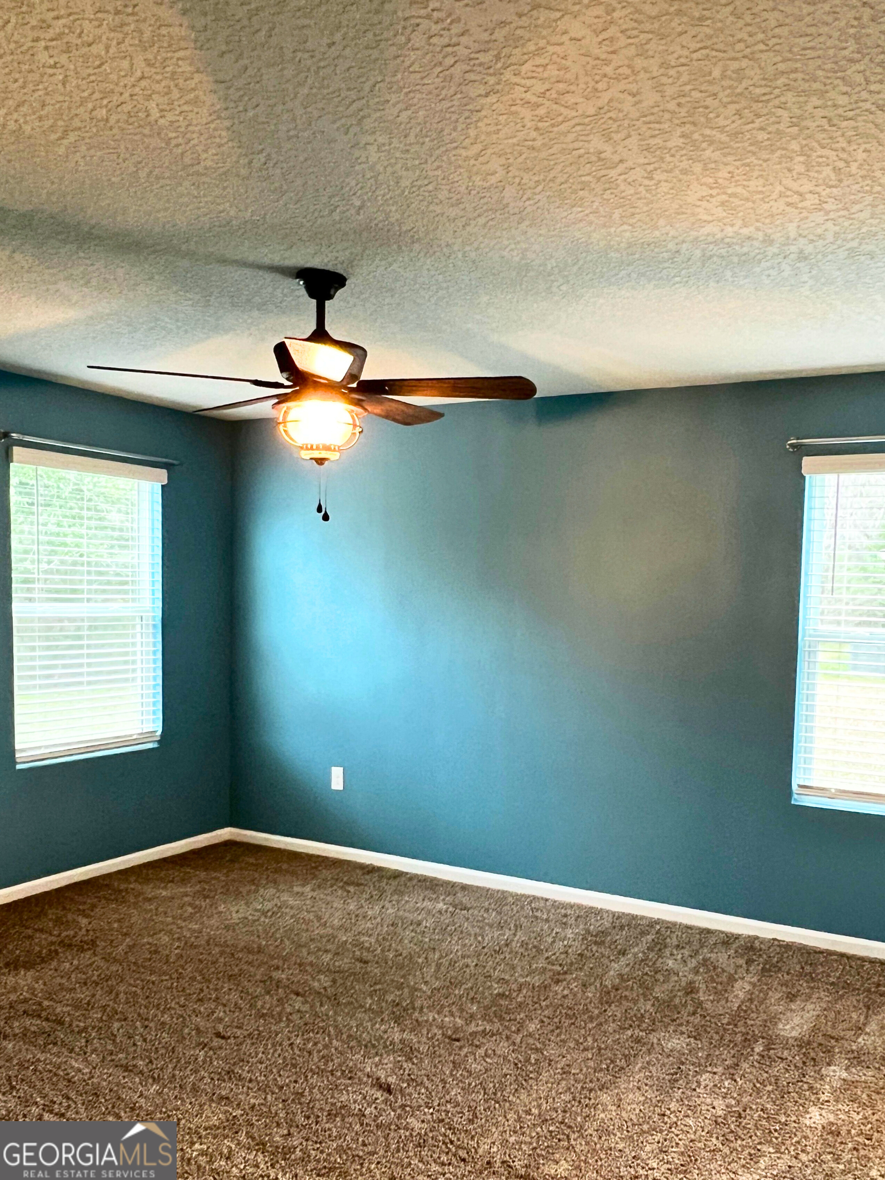 129 Holston Circle Kingsland, GA 31548 - Photo 20 of 25 an empty room with windows and fan