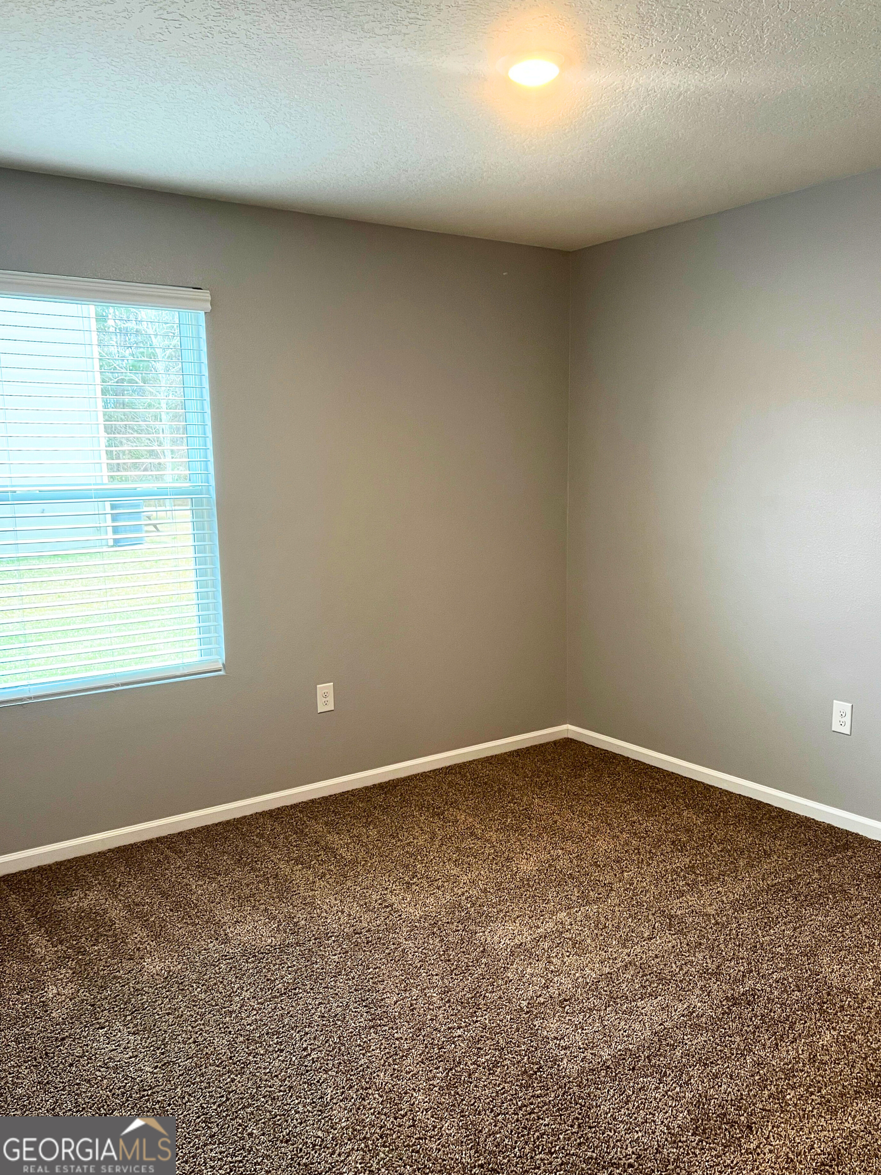 129 Holston Circle Kingsland, GA 31548 - Photo 7 of 25 an empty room with a window