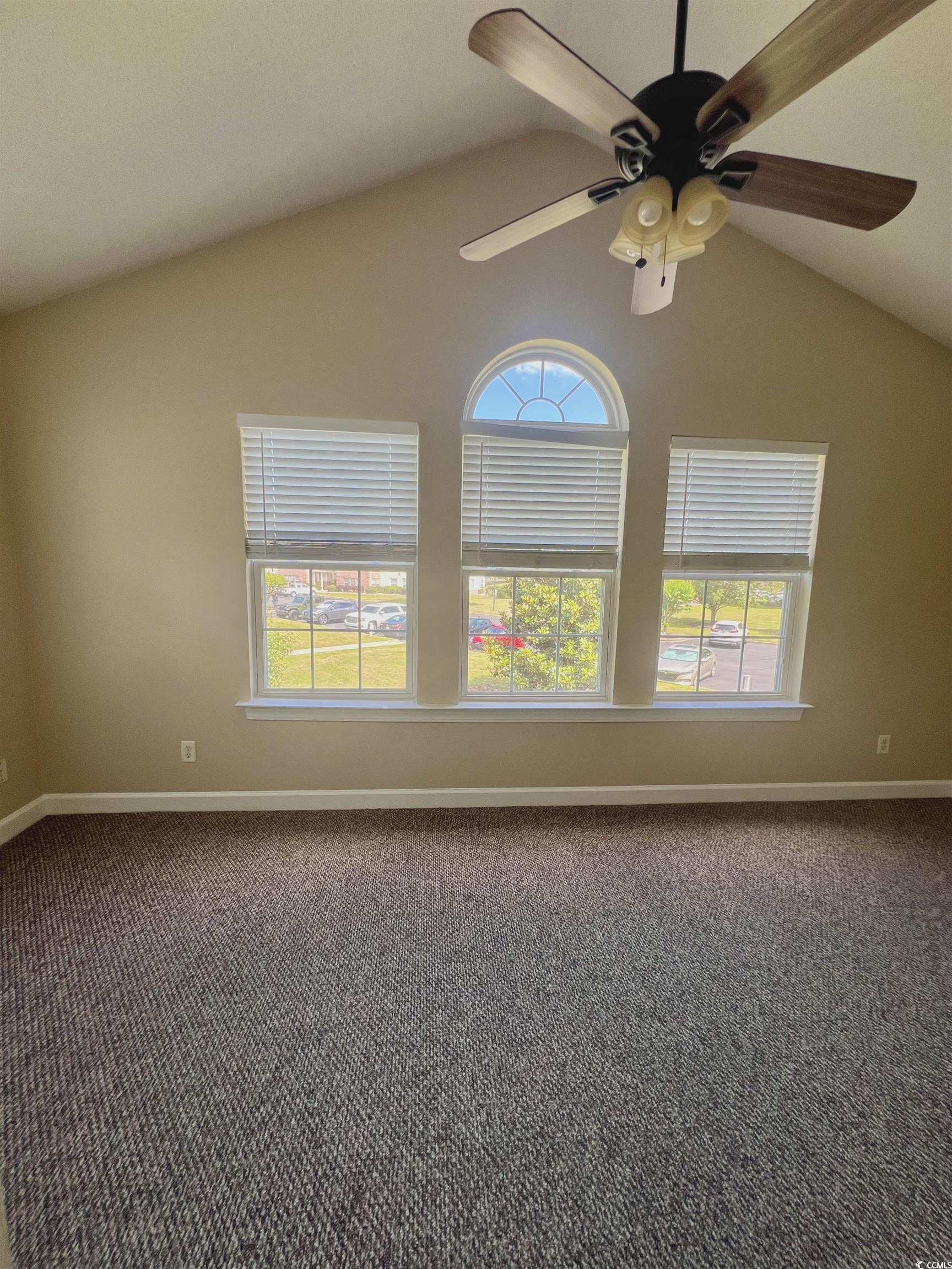 4394 Daphne Lane, Unit F Murrells Inlet, SC 29576 - Photo 30 of 40 Spare room featuring vaulted ceiling, carpet flooring, plenty of natural light, and ceiling fan