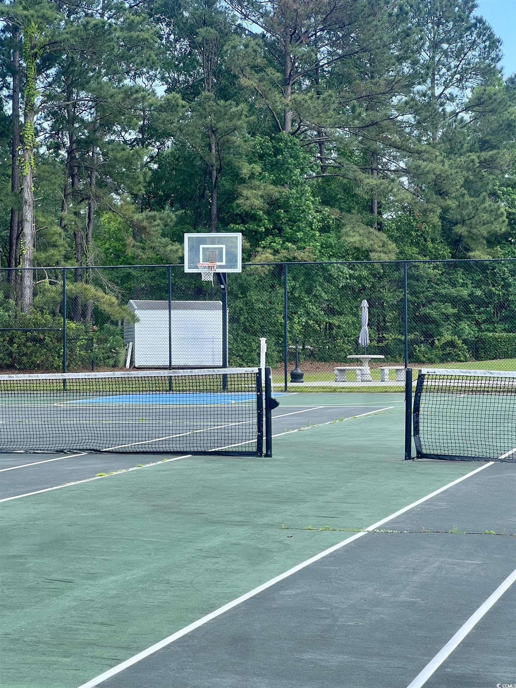 4394 Daphne Lane, Unit F Murrells Inlet, SC 29576 - Photo 36 of 40 View of sport court with a tennis court and fence