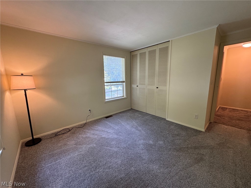 7294 Fox Mill Road, Unit 19D Mentor, OH 44060 - Photo 25 of 27 Neutral-toned walls complement the gray carpeting