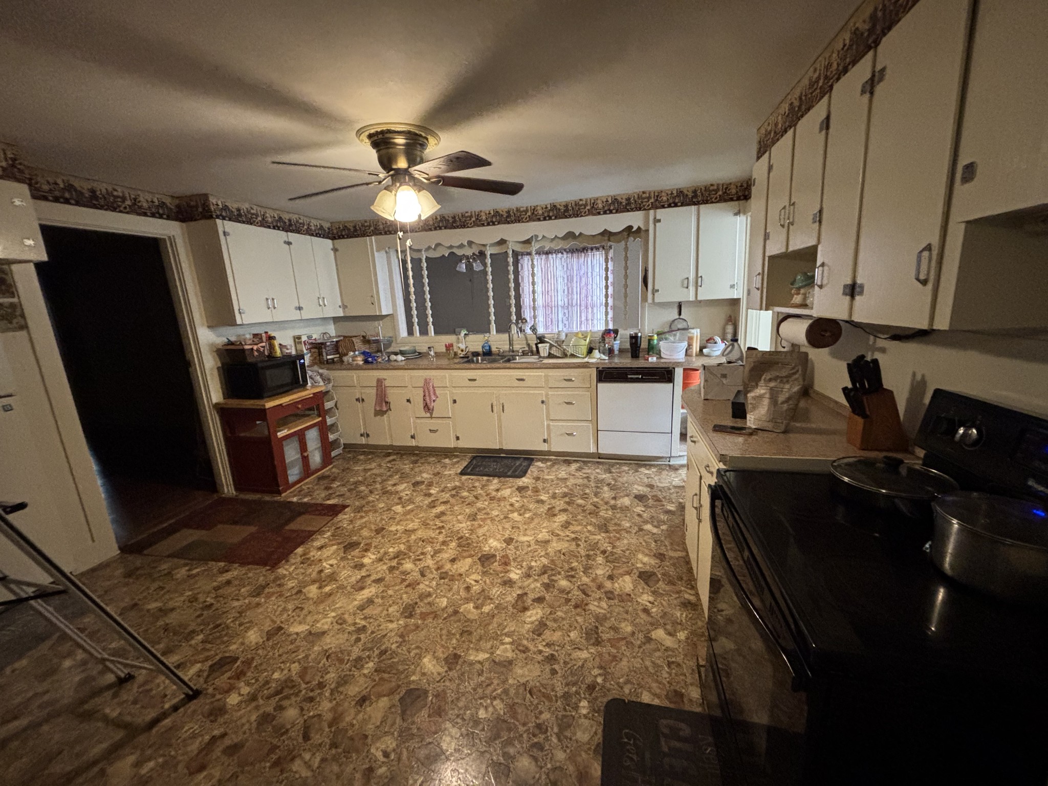 686 Clearview Road Cottontown, TN 37048 - Photo 16 of 22 a kitchen with refrigerator stove microwave and cabinets