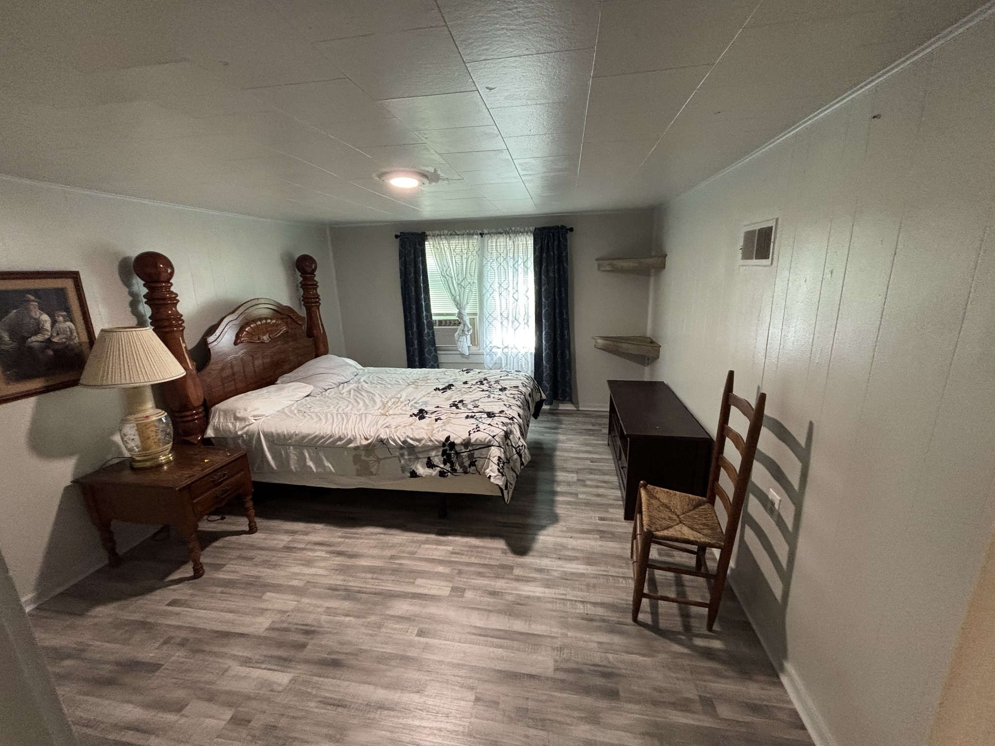 686 Clearview Road Cottontown, TN 37048 - Photo 21 of 22 a bedroom with furniture and a wooden floor