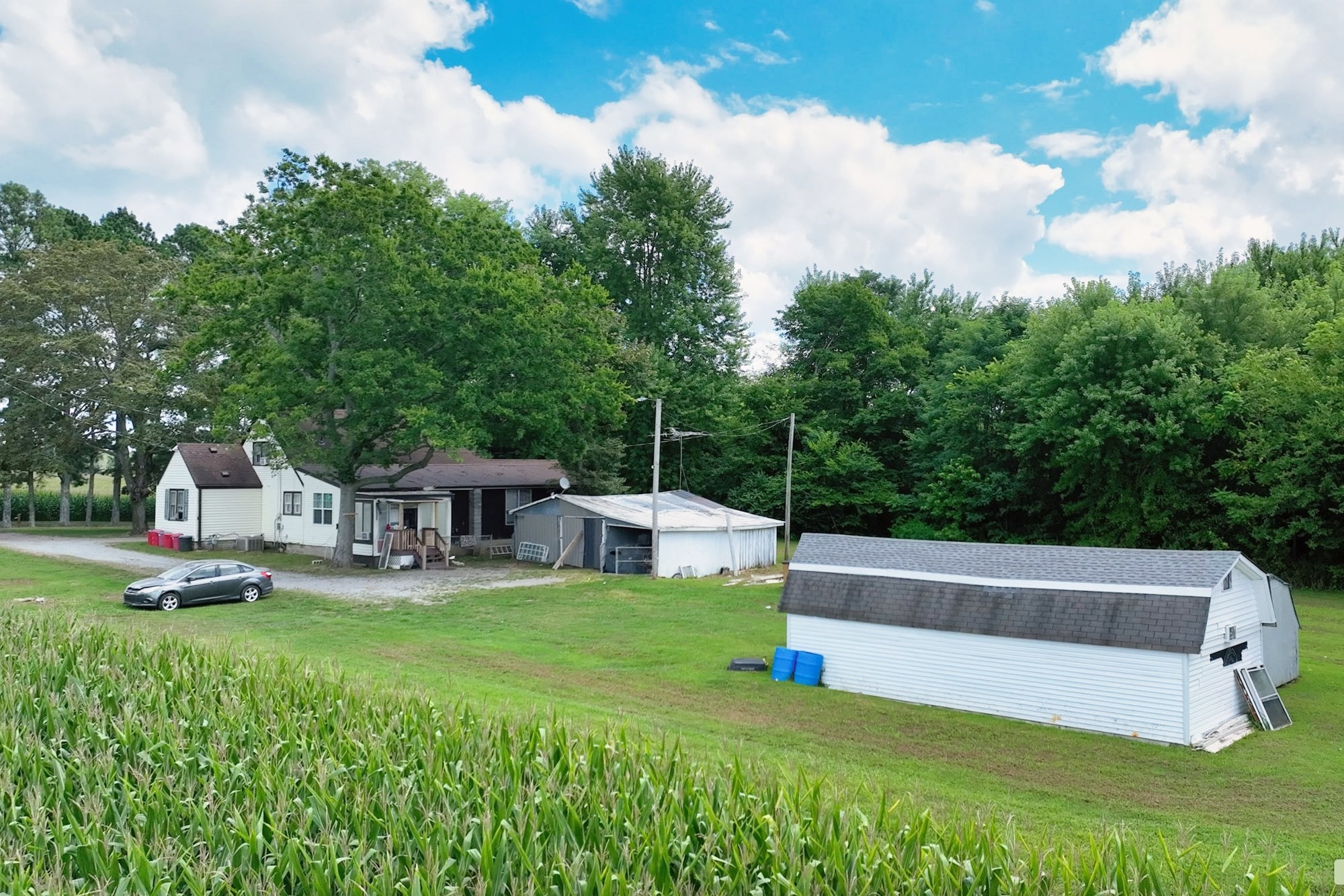 686 Clearview Road Cottontown, TN 37048 - Photo 3 of 22 a view of a house with a big yard and sitting area