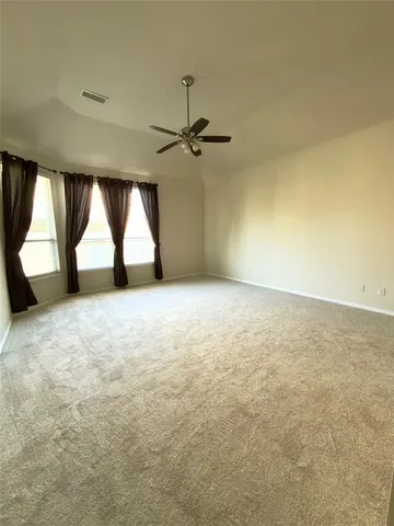 a white toilet sitting next to a white sink