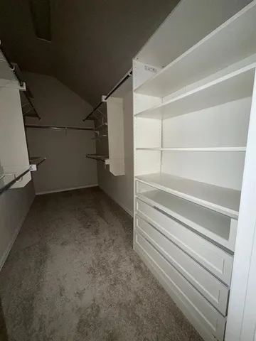 a view of an empty walk in closet
