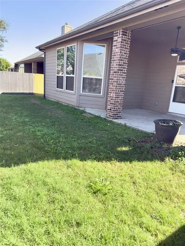 a view of backyard with a garden and plants