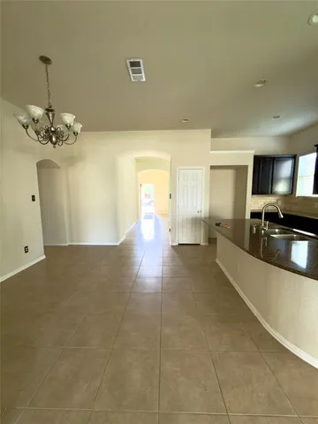 a kitchen with a stove and a refrigerator