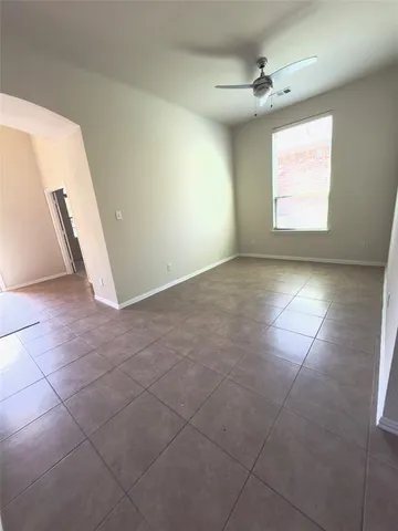 a large kitchen with kitchen island granite countertop a sink and a stove top oven