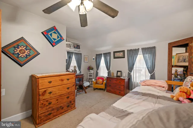 a bedroom with a bed and furniture