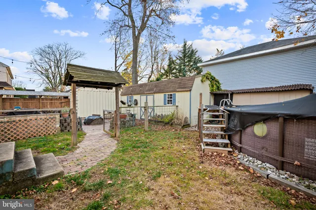 a view of a backyard with table and chairs