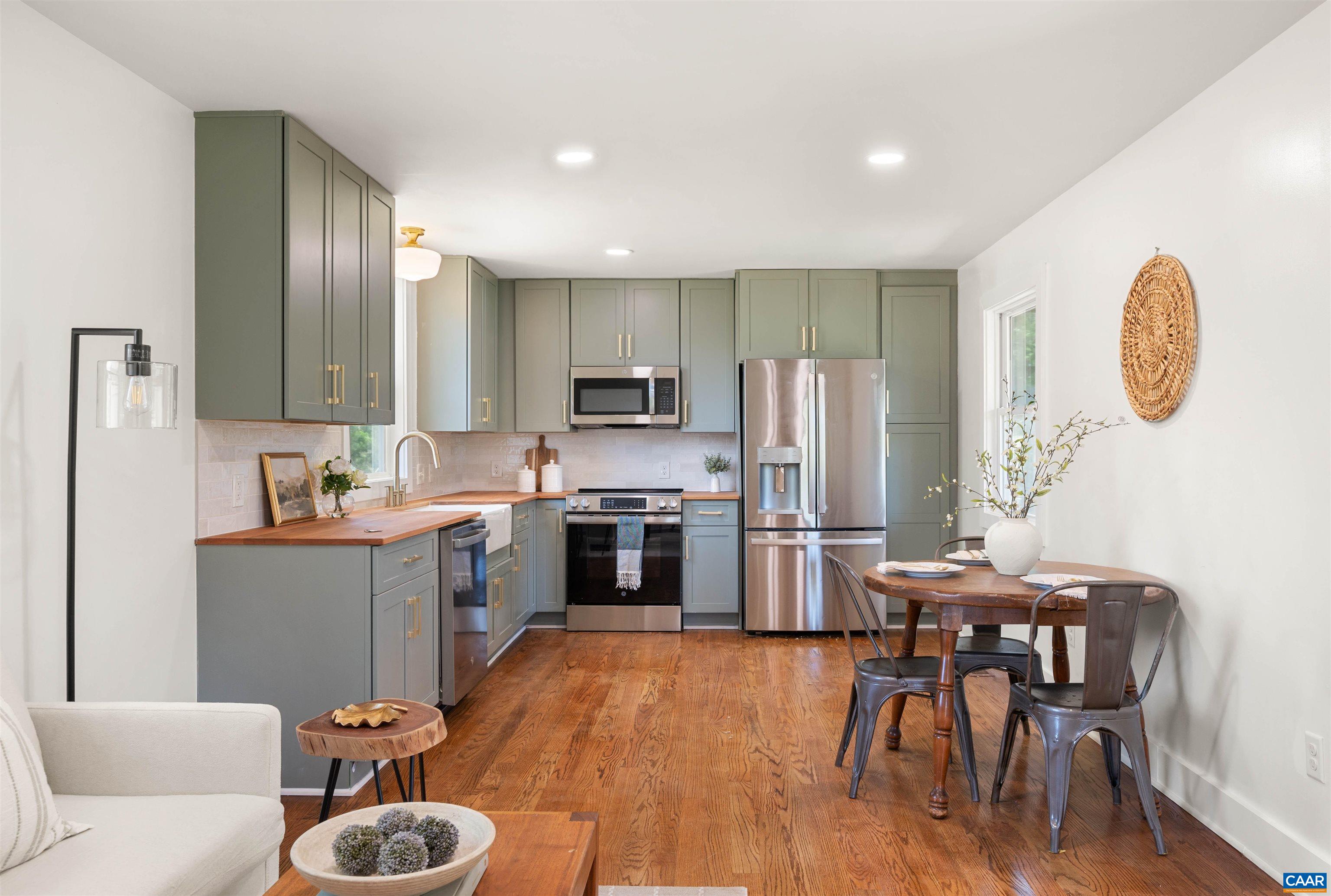 1867 Stage Junction Road Columbia, VA 23038 - Photo 18 of 46 a kitchen with refrigerator a sink and chairs