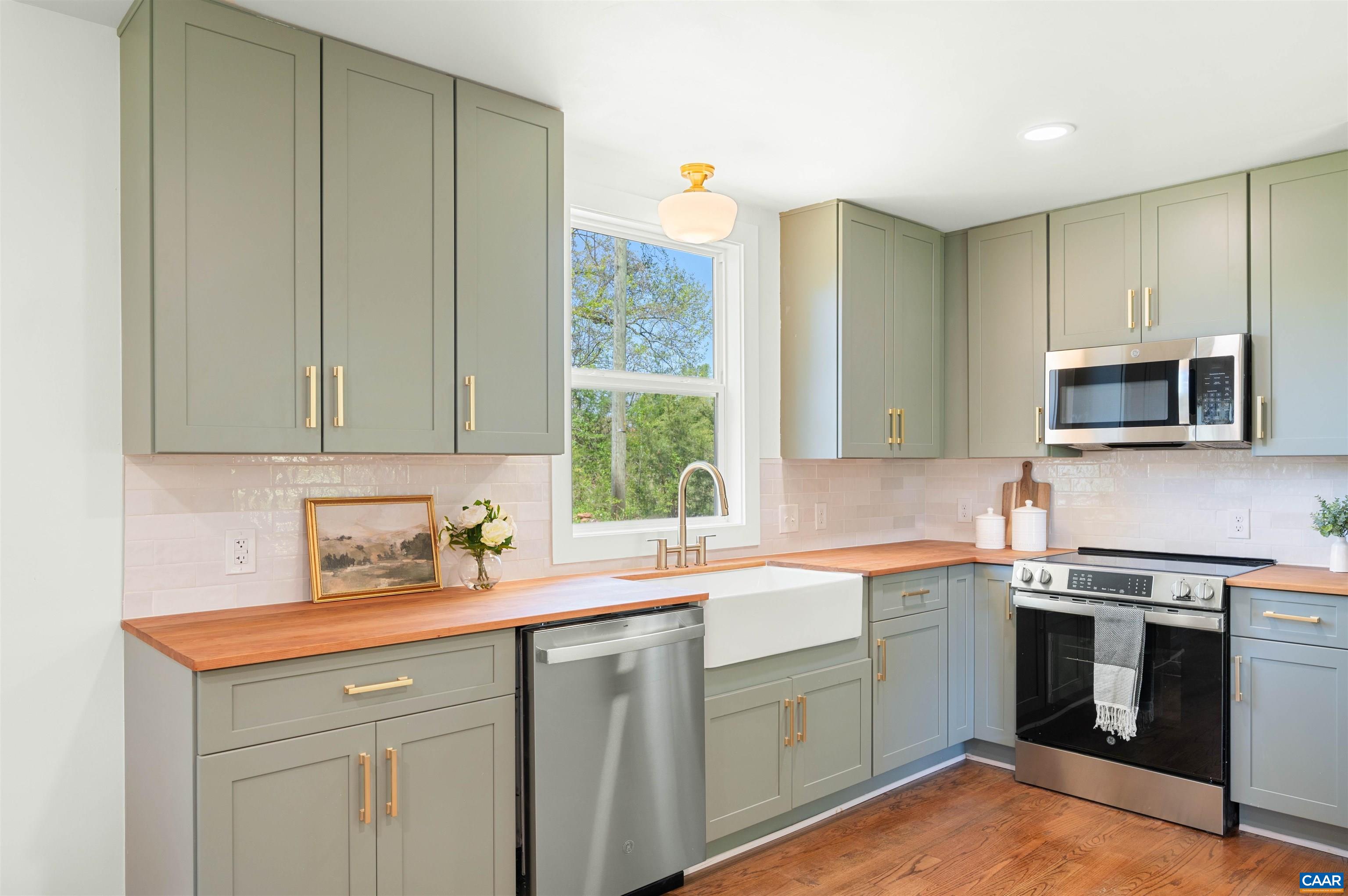 1867 Stage Junction Road Columbia, VA 23038 - Photo 20 of 46 a kitchen with a sink stove and microwave