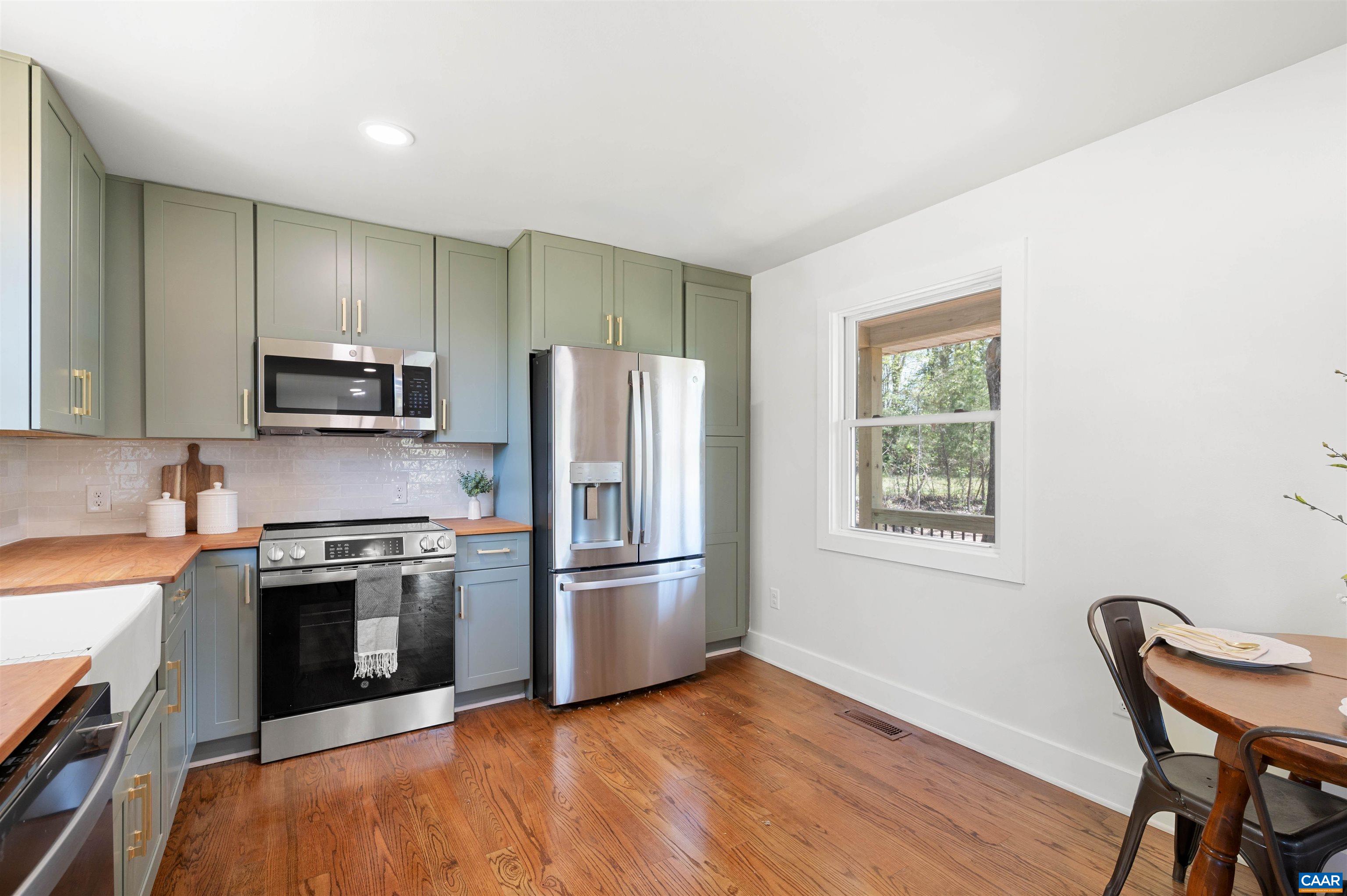 1867 Stage Junction Road Columbia, VA 23038 - Photo 21 of 46 a kitchen with granite countertop stainless steel appliances cabinets a sink and a stove