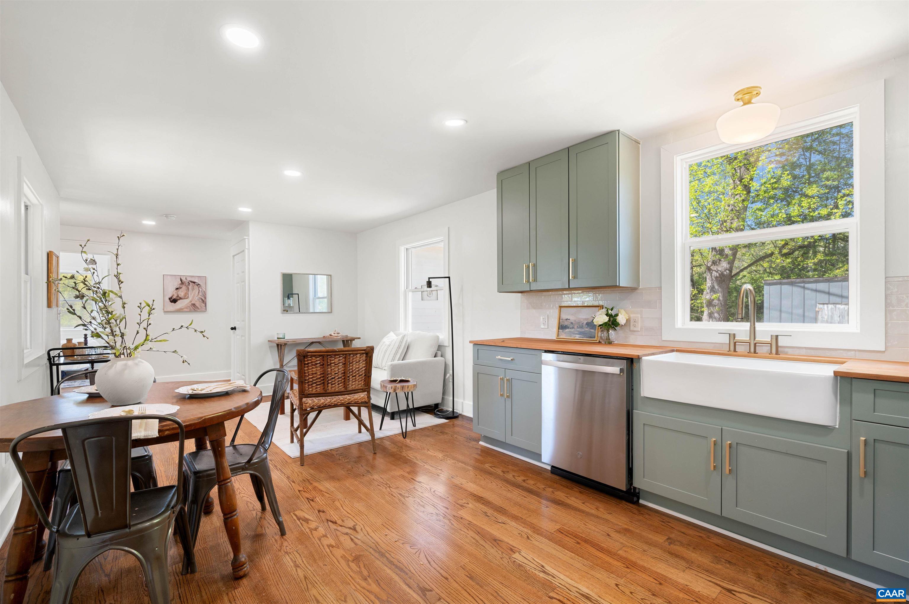 1867 Stage Junction Road Columbia, VA 23038 - Photo 24 of 46 a large kitchen with a table and chairs in it