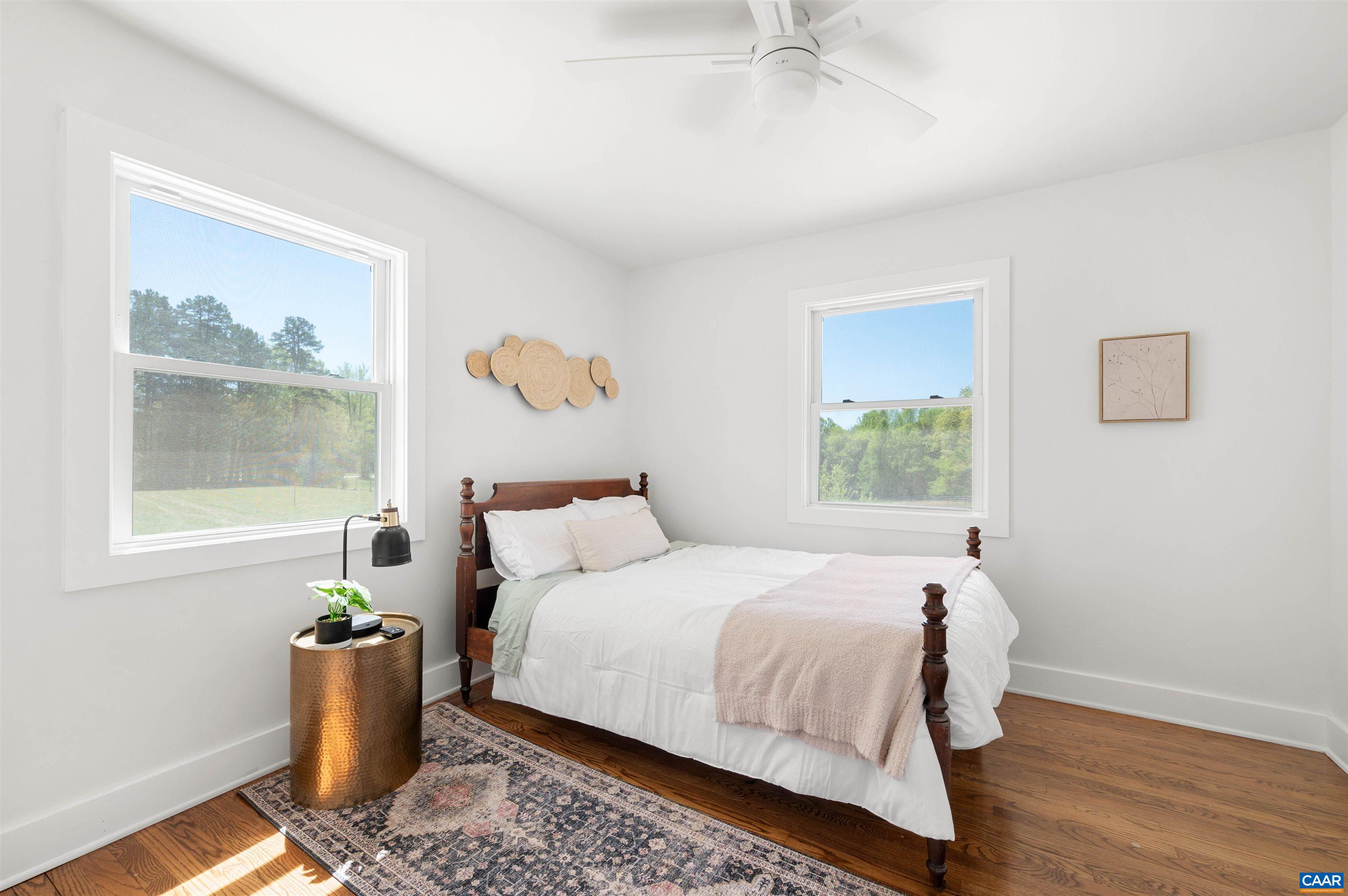 1867 Stage Junction Road Columbia, VA 23038 - Photo 27 of 46 a bedroom with a bed and wooden floor